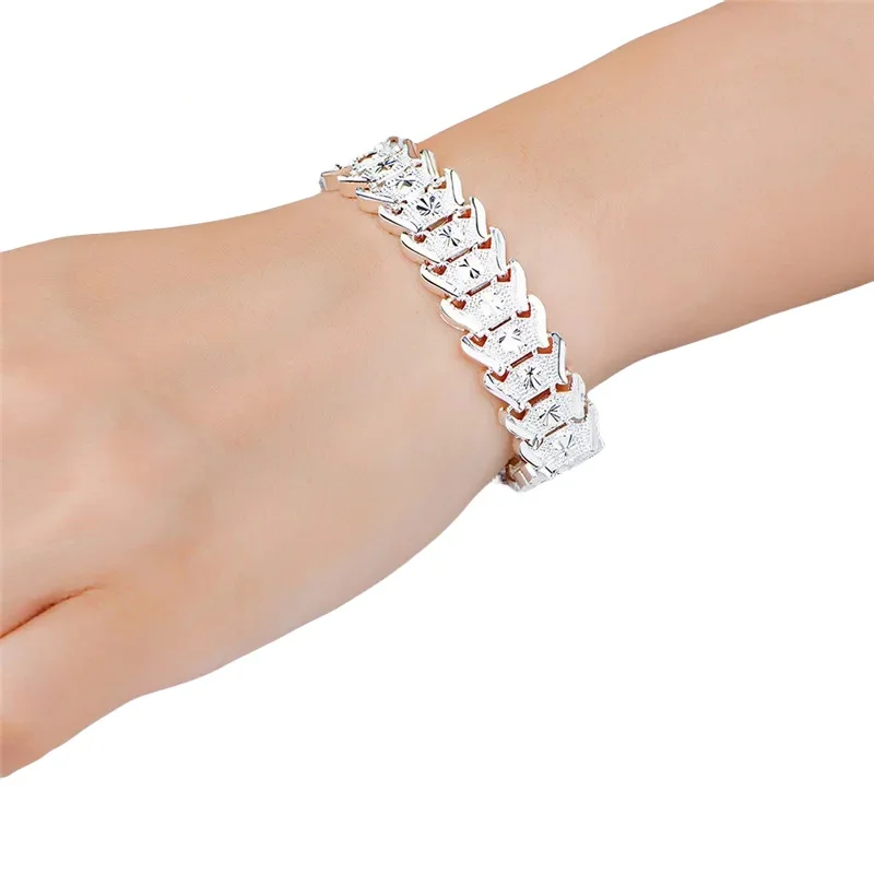 Fine Jewelry Watches Women - Zilveren gegraveerde schakelarmband, geometrische V-vormige gekoppelde